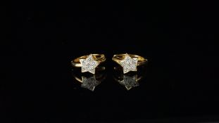 Pair of diamond set star design hoop earrings, mounted in unhallmarked yellow metal, each earring