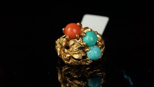 Turquoise and coral ring, bombe design with leaf detail and set with a round cabochon coral and