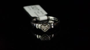 Three stone diamond heart shaped ring, mounted in hallmarked 9ct white gold, three brilliant cut