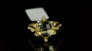 Citrine and diamond ring, central chequerboard citrine, with diamond set shoulders, mounted in