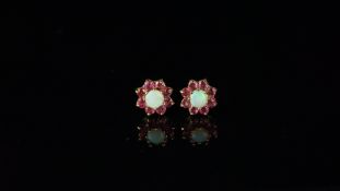 Pair of opal and ruby cluster ear studs, mounted in hallmarked 9ct yellow gold, with posts and