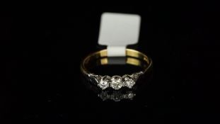 Three stone diamond ring, mounted in hallmarked 14ct yellow and white gold, three round diamonds, in