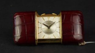 VINTAGE MOVADO ERMETOPHON TRAVEL CLOCK CIRCA 1950, square two tone silver dial with gold hour