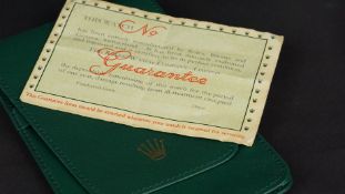 VINTAGE ROLEX GUARANTEE PAPERWORK, 10x7cm try fold booklet, unsigned, marked with Rolex Roll of