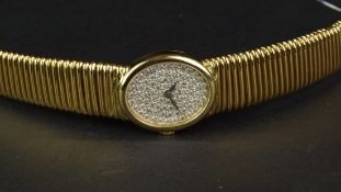 LADIES' PIAGET 18ct GOLD DIAMOND DIAL WRISTWATCH CIRCA 1980, circular full diamond set dial with