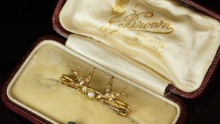 Antique double swallow brooch set with pearls, mounted in unmarked yellow metal, with a single pearl