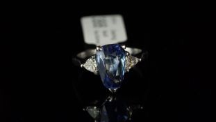 Sapphire and diamond three stone ring, mounted in white metal, partial French eagle's head mark to
