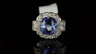 Ceylon sapphire and diamond fancy cluster ring, mounted in white metal with partial marks to the