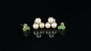 Two pairs of gem set earrings, including a pair set with three emeralds, stamped 14k, post fittings,