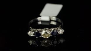 Five stone sapphire and diamond ring, set with three round brilliant cut diamonds and two round