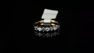 Seven stone blue stone and diamond half eternity ring, mounted in hallmarked 9ct yellow gold, four