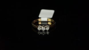 Three stone diamond ring, mounted in hallmarked 9ct yellow gold, three round brilliant cut diamonds,