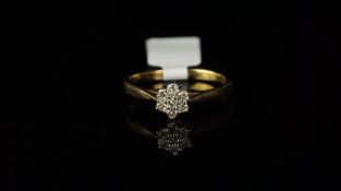 Seven stone diamond cluster ring, mounted in hallmarked 9ct yellow gold, seven round brilliant cut