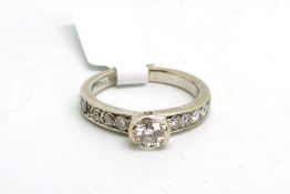 Diamond ring, central round brilliant cut diamond, weighing an estimated 0.44ct, estimated colour G,