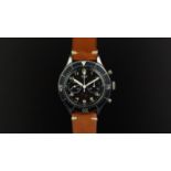 GENTLEMEN'S HEUER 'BUND' MILITARY FLYBACK CHRONOGRAPH WRISTWATCH REF. 1550 89, circular black twin