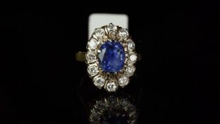 Ceylon sapphire and diamond oval cluster ring, mounted in yellow metal stamped with the French