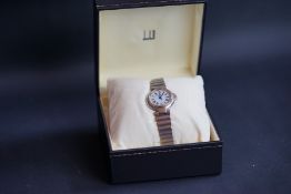 LADIES DUNHILL, white dial with black Roman numerals, stainless steel case and bracelet,