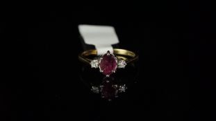 Three stone ruby stone and diamond ring, mounted in hallmarked 9ct yellow gold, central oval ruby
