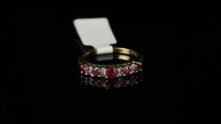 Thirteen stone ruby and diamond half eternity ring, mounted in 9ct yellow gold, five round rubies,