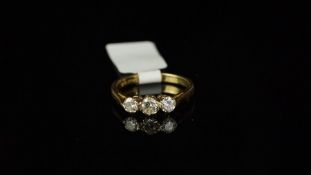 Three stone diamond claw set ring mounted in hallmarked 18ct yellow gold, approx. diamond weight 0.