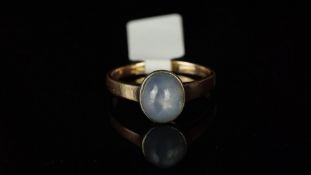 Single stone star sapphire ring, mounted in yellow metal stamped with a swan import mark and a