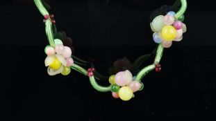 Glass bead necklace, designed as floral clusters, separated by glass tubes