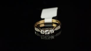 A cubic zirconia ring, set in yellow metal, ring size L
