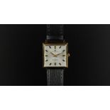 GENTLEMEN'S UNIVERSAL GENEVE WRISTWATCH CIRCA 1964, square silver dial with golf and black hour