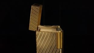 A gilt metal Dupont lighter, with textured finish