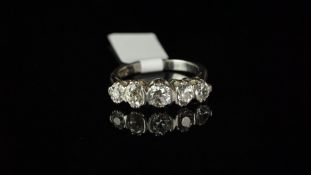Five stone diamond ring, mounted in hallmarked platinum, set with five old cut diamonds, high claw