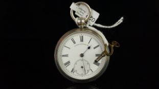 Silver open face pocket watch with key, round white dial signed Alfred Russell & Co., black Roman