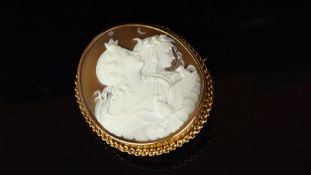 Cameo brooch, carved shell cameo of a male and female figure, in profile, with a bird in front of