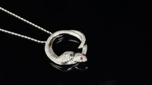 Diamond set double entwined snake pendant mounted in white metal stamped 'K18WG', one snake with