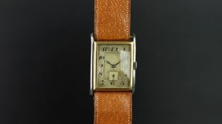 GENTLEMEN'S 1930/40s BI COLOUR WRISTWATCH, rectangular aged dial with Arabic numerals, gun metal