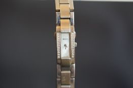 LADIES' GUCCI 4600L DIAMOND SET WRISTWATCH, rectangular mother of pearl dial with silver hands,