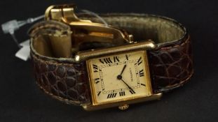 MID SIZE CARTIER TANK 18ct GOLD QUARTZ WRISTWATCH, rectangular patina dial with Roman numerals and