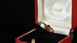 Cartier tricolour gold band ring, made up of rose, yellow and white gold alternating chevrons,