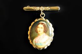 Painted portrait brooch, oval porcelain portrait of a maiden, with a yellow metal frame, suspended