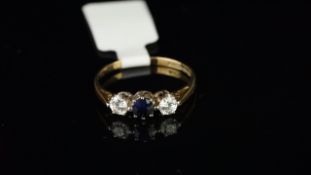 Sapphire and cubic zirconia three stone ring, mounted in 9ct yellow gold, finger size L, gross