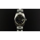 GENTLEMEN'S ROLEX OYSTER PERPETUAL DATE WRISTWATCH REF. 1500, circular black gloss dial with gold