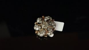 Diamond set brooch mounted in unmarked yellow and white metal, signed Buccellati, set with a central