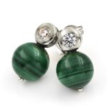 A pair of malachite and cubic zirconia set earrings. The spherical malachite beads suspended below