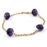 An amethyst bead bracelet. The faceted amethyst beads to an 18kt yellow gold chain. Diameter of