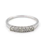 A diamond set ring. The ring designed as a uniform row of seven brilliant cut diamonds, 18kt white