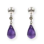 A pair of amethyst and diamond set earrings. Each designed as a polished circular surmount