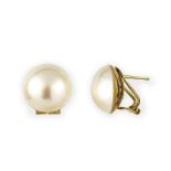 A pair of mabe pearl stud earrings. The white mabe pearls to post and hinged omega back fittings,