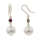 A pair of cultured pearl and ruby earrings. The white freshwater cultured pearls suspended below