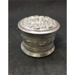 Ornate Embossed Indian Silver Lidded Round Box measures approx 9.3cm dia and 7.5cnm tall weight 155