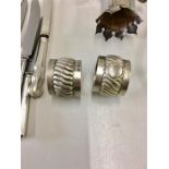 Pair of silver napkin rings & collection of siver handled knives with a silver plated Claret Jug Mou