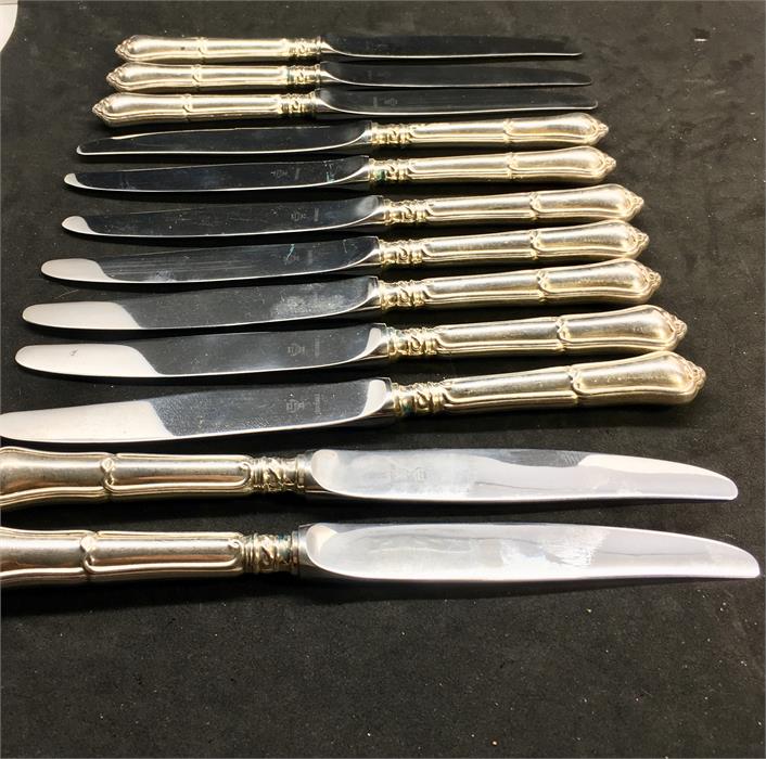 Set of 12 silver handle Table Knives each measures approx 18cm long hallmarked 925 on handle with si